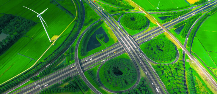 Highway with green fields and focused on the ESG/Impact Investing opportunities