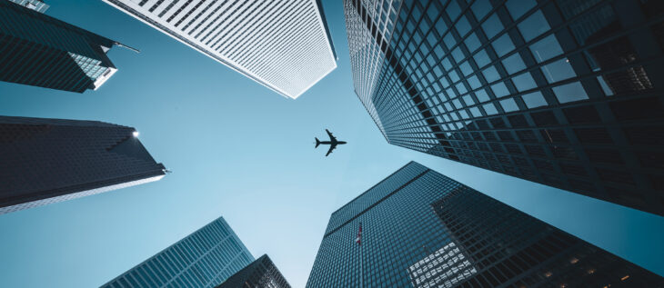 A city view that is looking up between the buildings and these are bank and credit union buildings