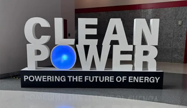 CLEANPOWER conference sign with glowing blue globe and Powering the Future of Energy tagline in convention center lobby