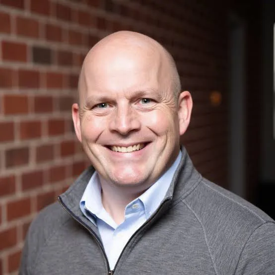 Ryan Nauman Headshot Ryan Nauman, host of the Views from 6,230 podcast and 20-year wealth management and fintech industry veteran, in a professional headshot.